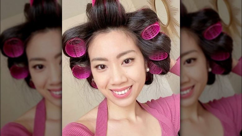 Woman with rollers in hair