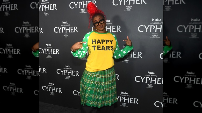 Tierra Whack wearing green plaid skirt