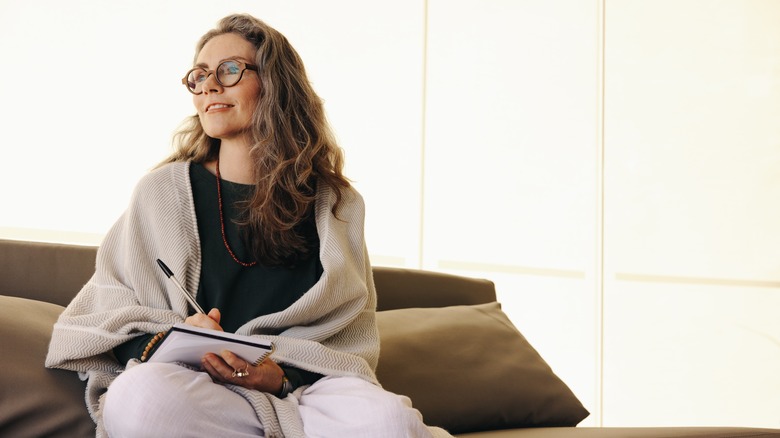 Woman writes in journal