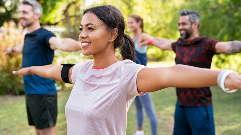 Woman attends aerobics class