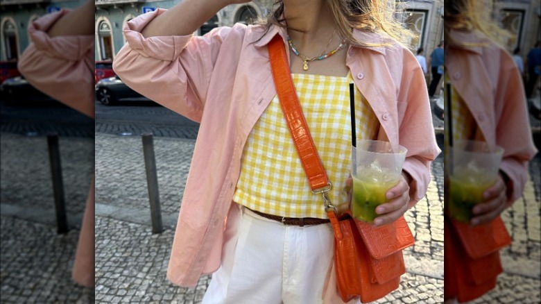Woman wearing yellow gingham top