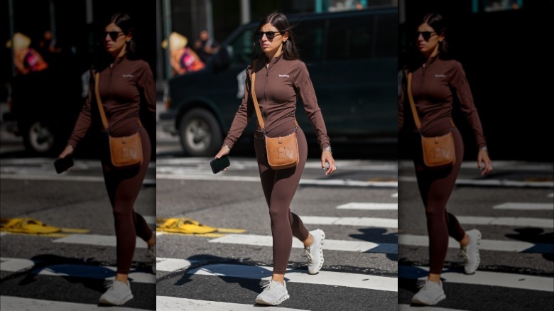 A woman wearing brown leggings with a brown top