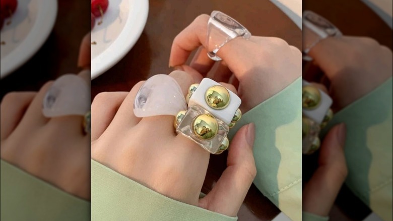 Hand wearing plastic rings