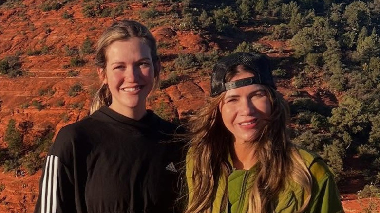 Kristi Noem posing with no makeup next to her daughter outside