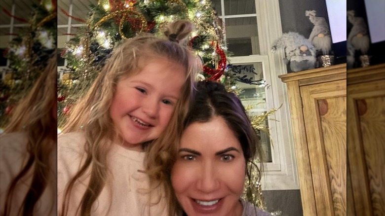 Kristi Noem taking a selfie with her granddaughter without much makeup