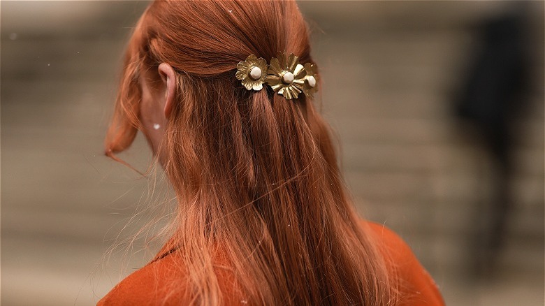 close up of person with long red hair