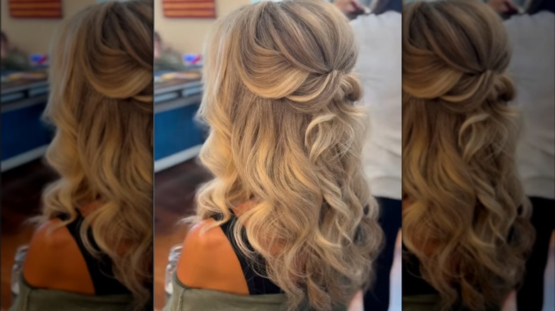 Woman with half updo with loose waves