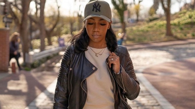 Woman wearing baseball cap