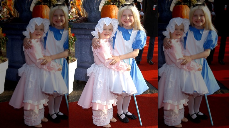 Child Elle Fanning and Dakota Fanning in Halloween costumes
