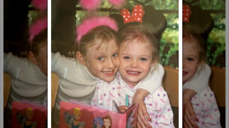 Dakota Fanning hugs Elle Fanning in childhood photo