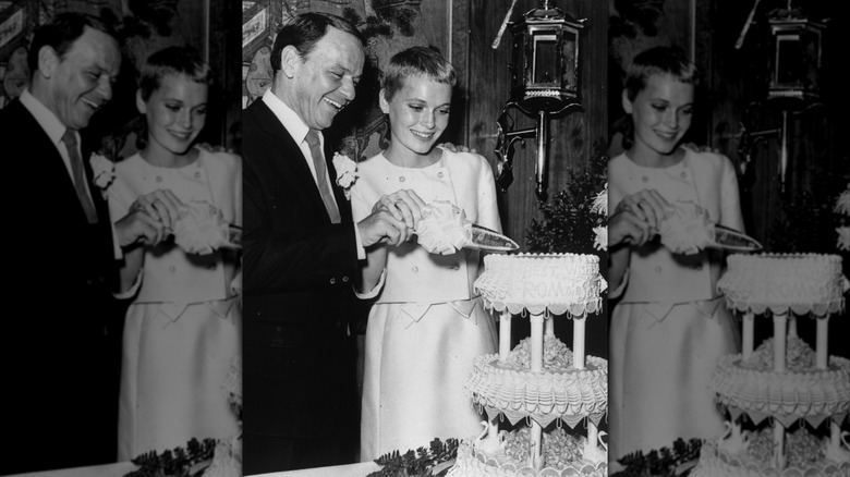 Singer Frank Sinatra and Mia Farrow cutting their wedding cake at Las Vegas in 1966