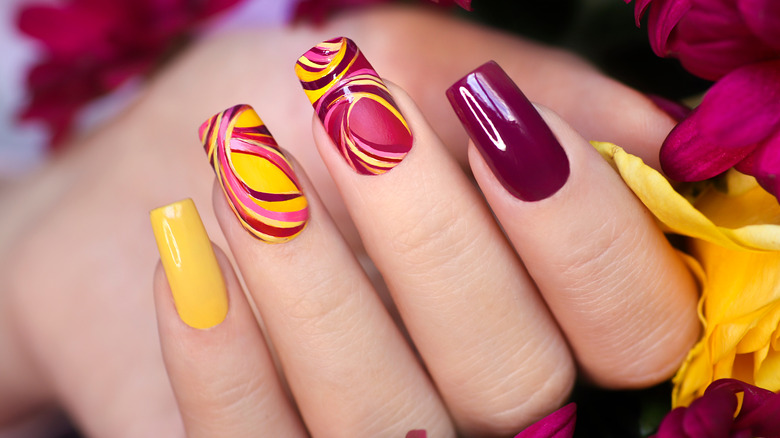 A brightly-colored manicure
