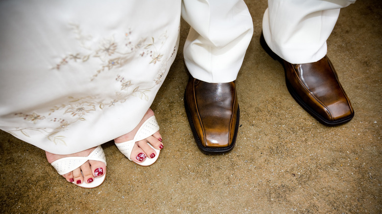 Feet of bride and groom