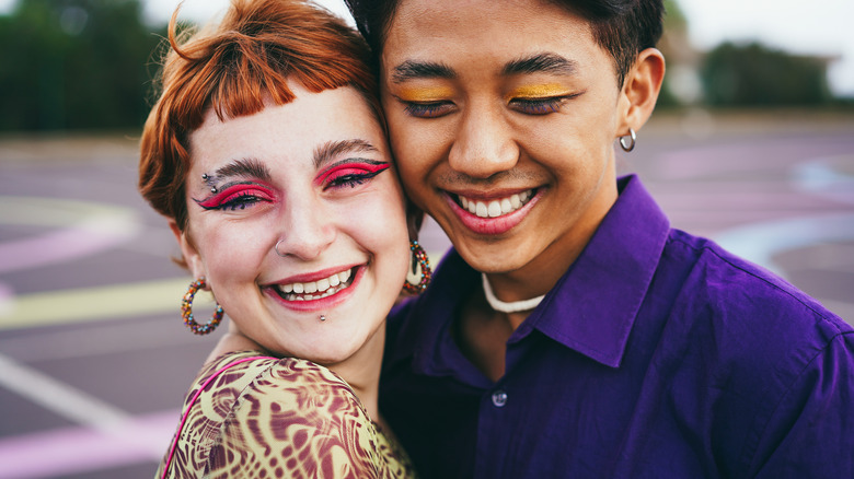 Woman and man wearing eyeshadow