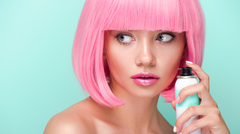 Girl with pink bob and spray