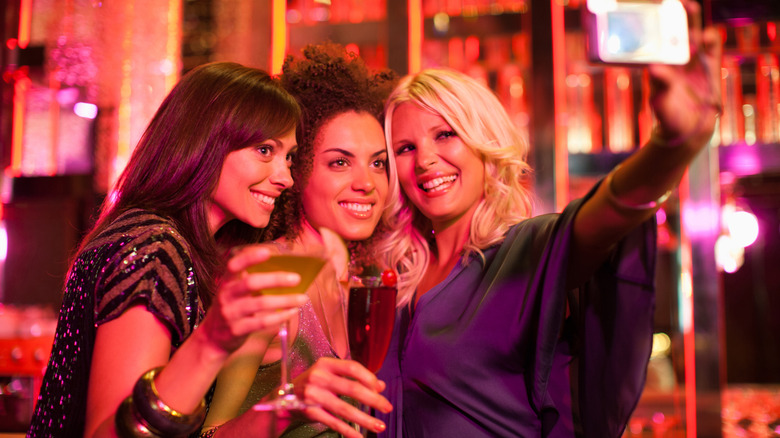 three women at bar