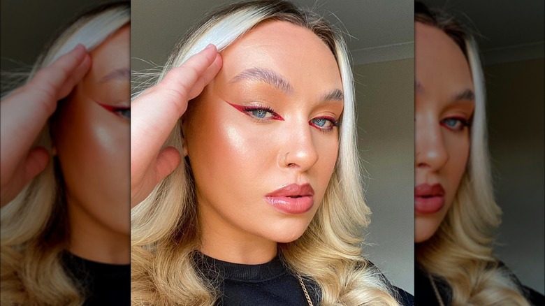 girl wearing red eyeliner