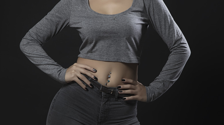 Crop top and belly button piercing