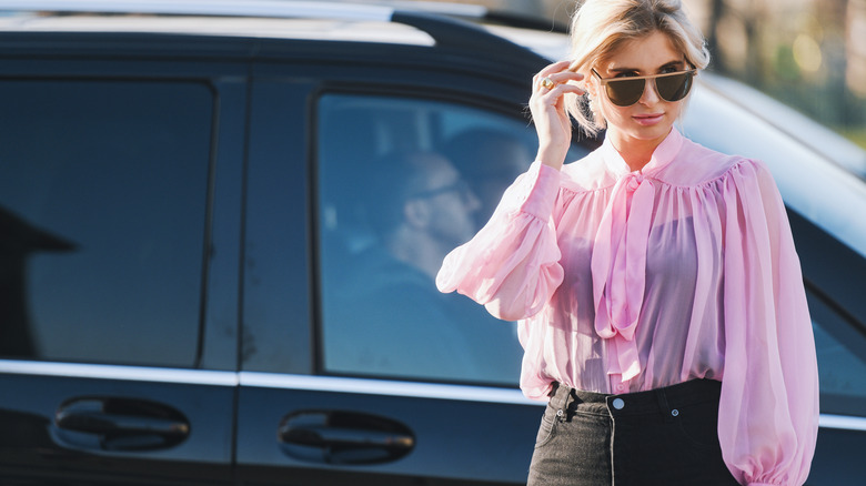 woman wearing pink pussybow blouse