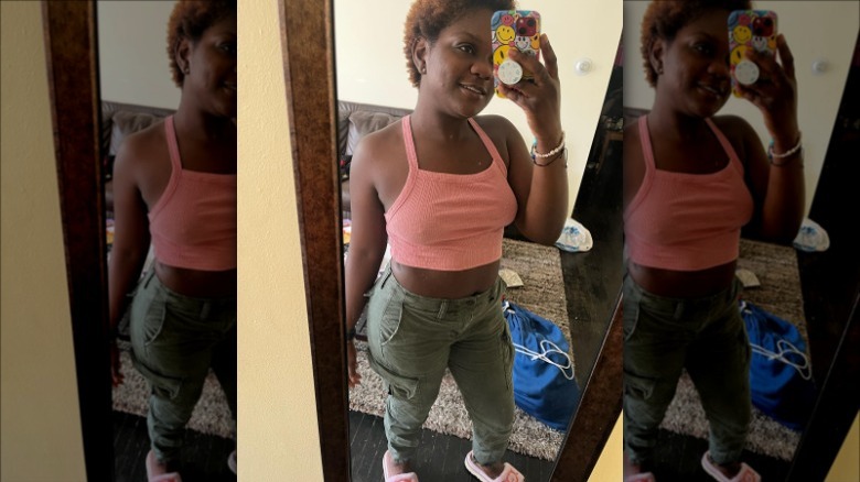 Woman wearing pink ribbed tank