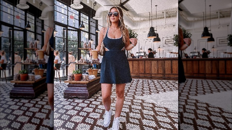 Girl wearing black and white athletic dress.