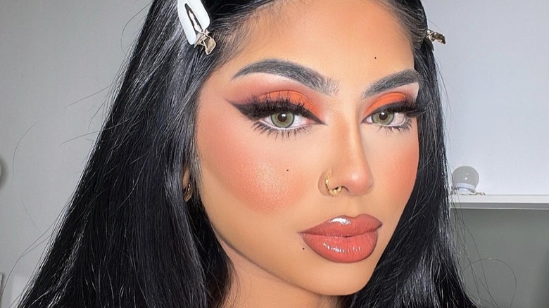 woman wearing orange blush