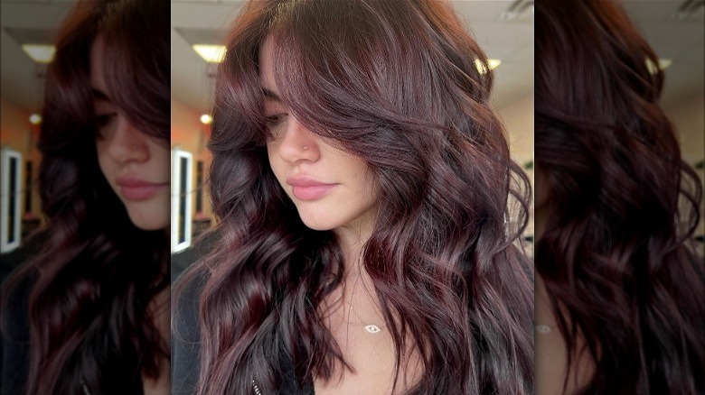 Woman with mild burgundy hair color