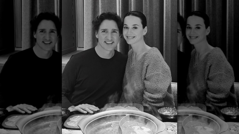 Katy Perry and Justin Trudeau posing for a black and white photo