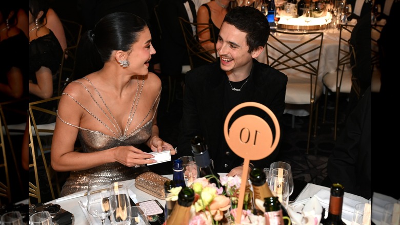 Kylie Jenner and Timothée Chalamet laughing together at the 2026 Golden Globes