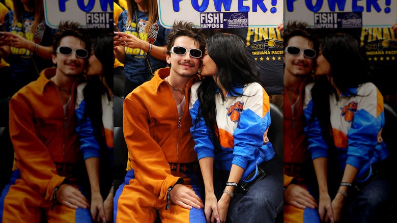 Kylie Jenner and Timothée Chalamet posing together at a basketball game