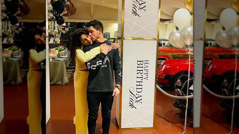 Nick Jonas kisses Priyanka Chopra as she hugs him on his birthday
