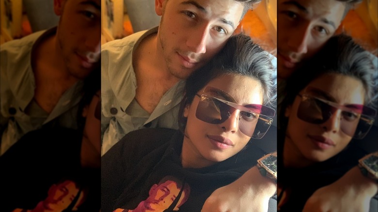 Nick Jonas and Priyanka Chopra lay beside each other