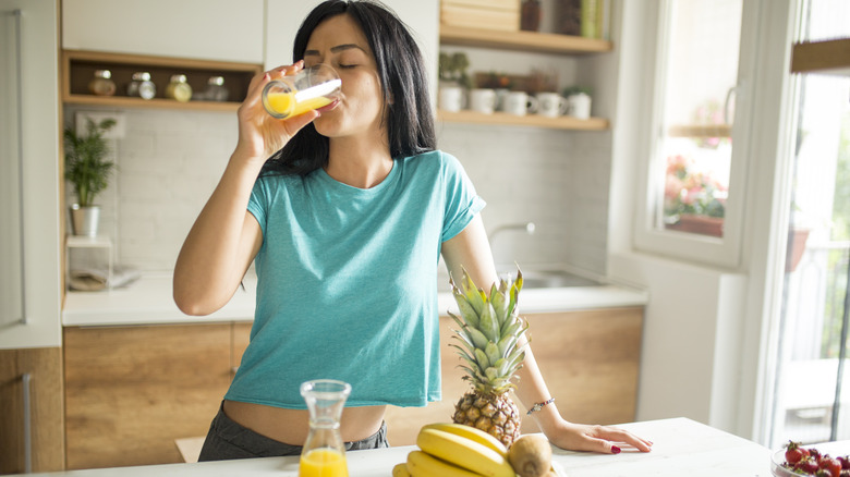 Woman drinking orange juice