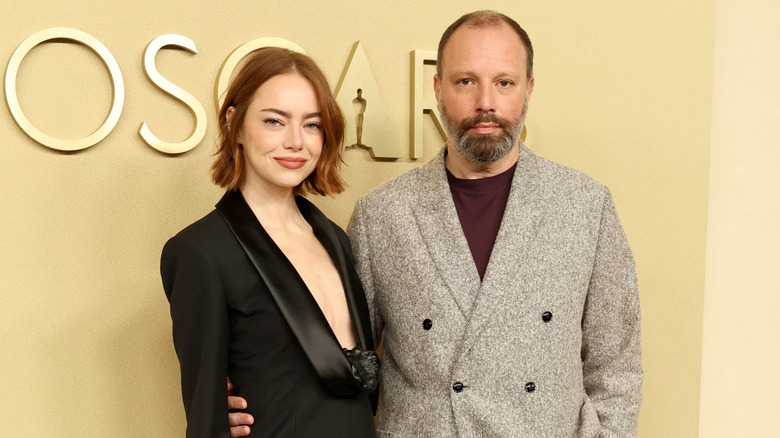 Emma Stone and Yorgos Lanthimos posing