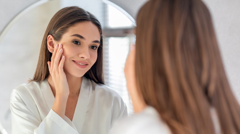 person admiring their face