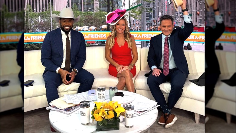 Ainsley Earhardt, Lawrence Jones III, and Brian Kilmeade are photographed while sitting together on a couch