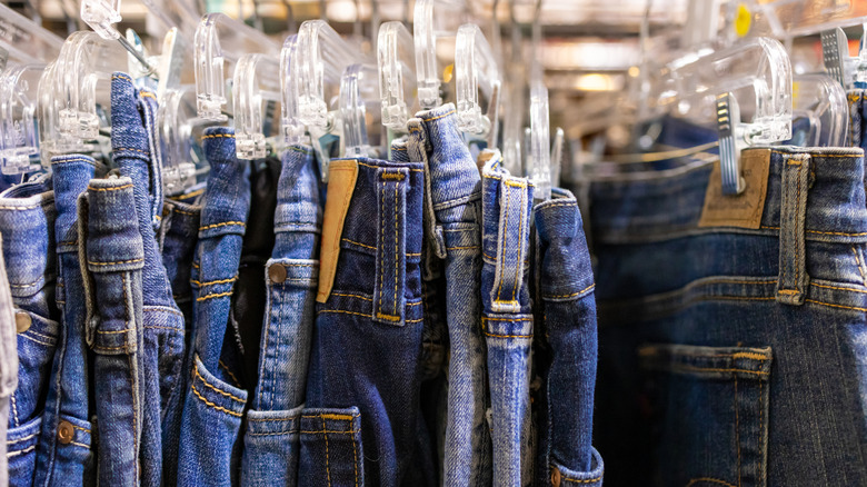 Jeans hanging in a store