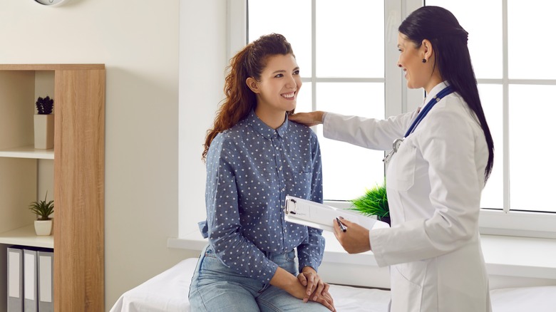 woman speaking to doctor