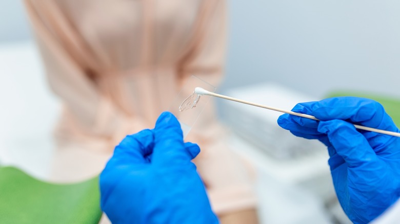 gynecologist holding instruments