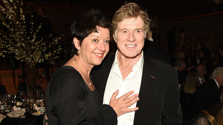 Robert Redford and his wife, ﻿﻿Sibylle Szaggars, smiling and posing for a photo Redford at the ﻿42nd Chaplin Award Gala