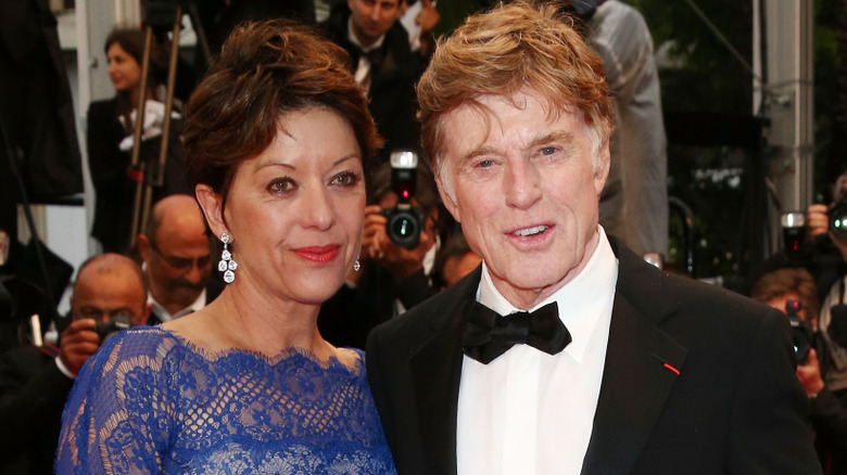 Robert Redford and his wife, ﻿﻿Sibylle Szaggars, posing for a photo at the 'All Is Lost' Premiere