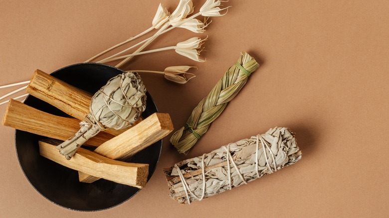 Bowl of palo santo and sage bundles