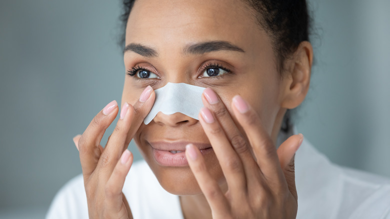 Woman using a nose strip
