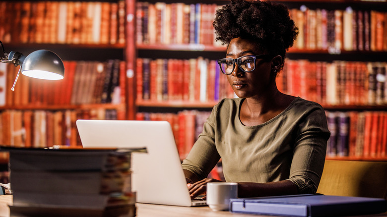 woman using laptop library