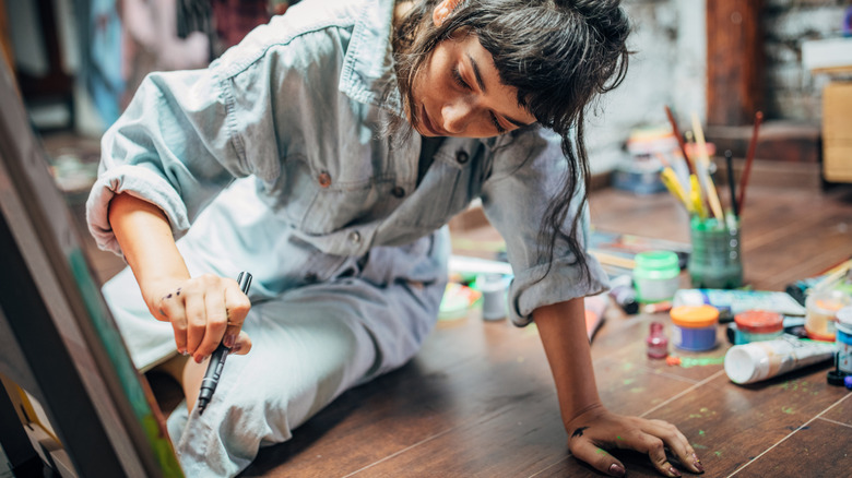 woman painting in art studio