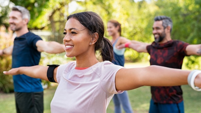 People balancing with arms up