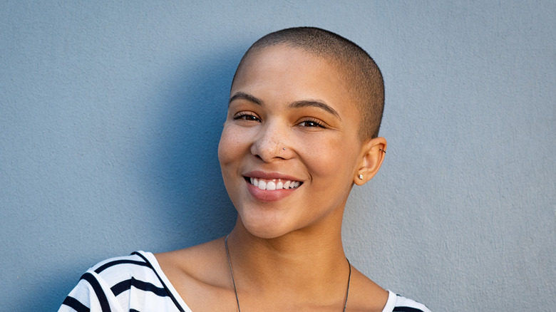 Woman shaves her head