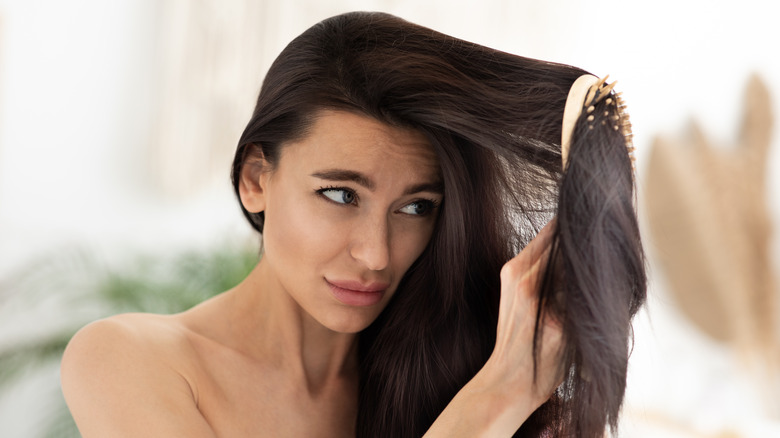 woman brushing matted hair