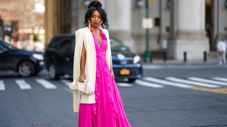 woman wearing coat and maxi dress