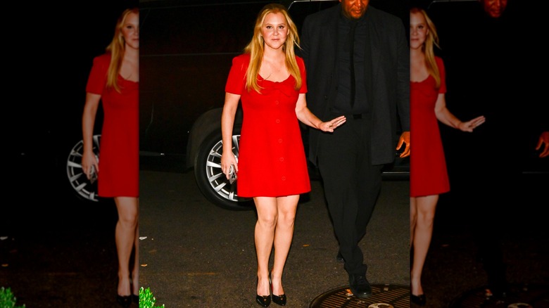 Amy Schumer wearing a red dress